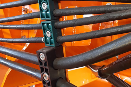 multiple DIN clamps on an agricultural machine