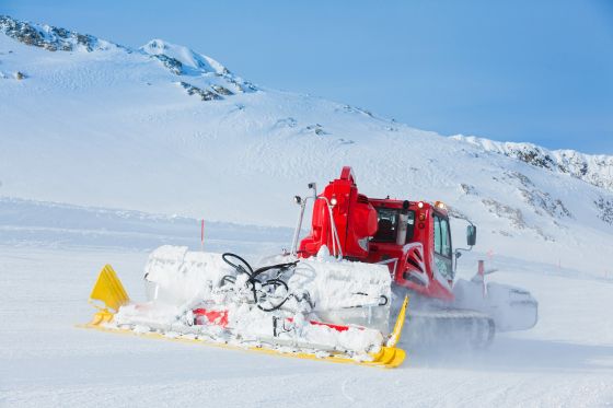Snow groomer in the high mountains