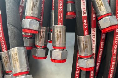 Finished hose assemblies with caps on the hose fittings