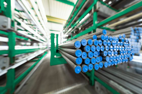 pipes and tubes on a stack in a warehouse