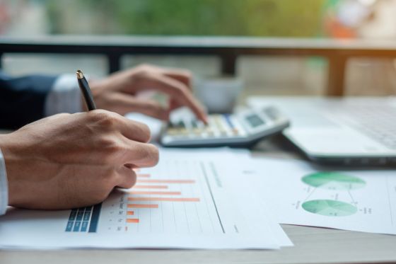 Person writing or drawing something with a pencil