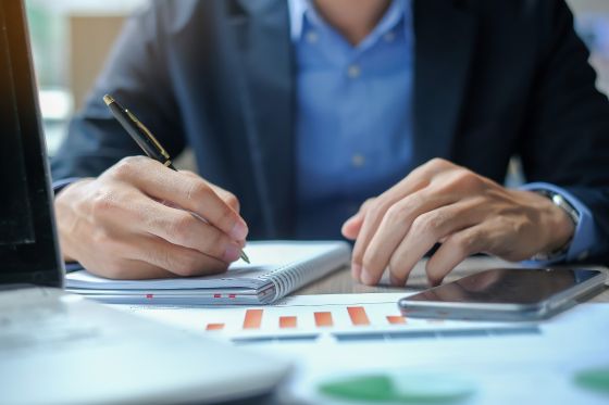 person writing a note